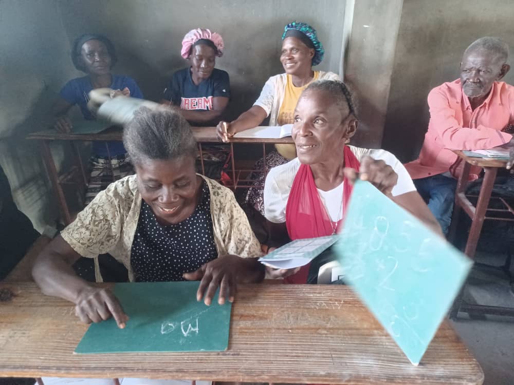 Jacqueline and adult literacy classmates, village of Lagaren, Haiti